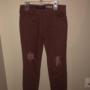 Maroon aeropostale jeans with fringed ankles